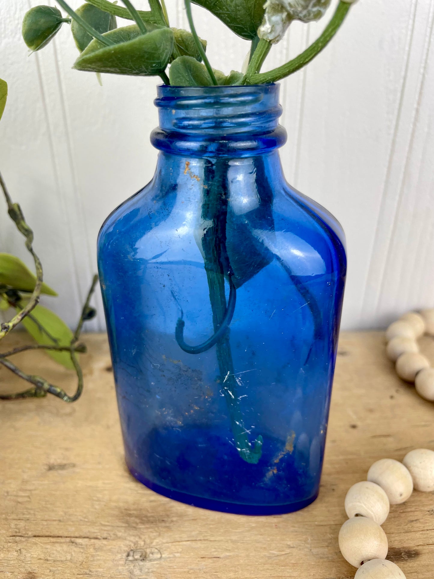 Vintage Cobalt Blue Glass Medicine Bottle with Greenery