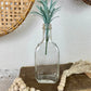 Vintage Clear Glass Bottle with Greenery