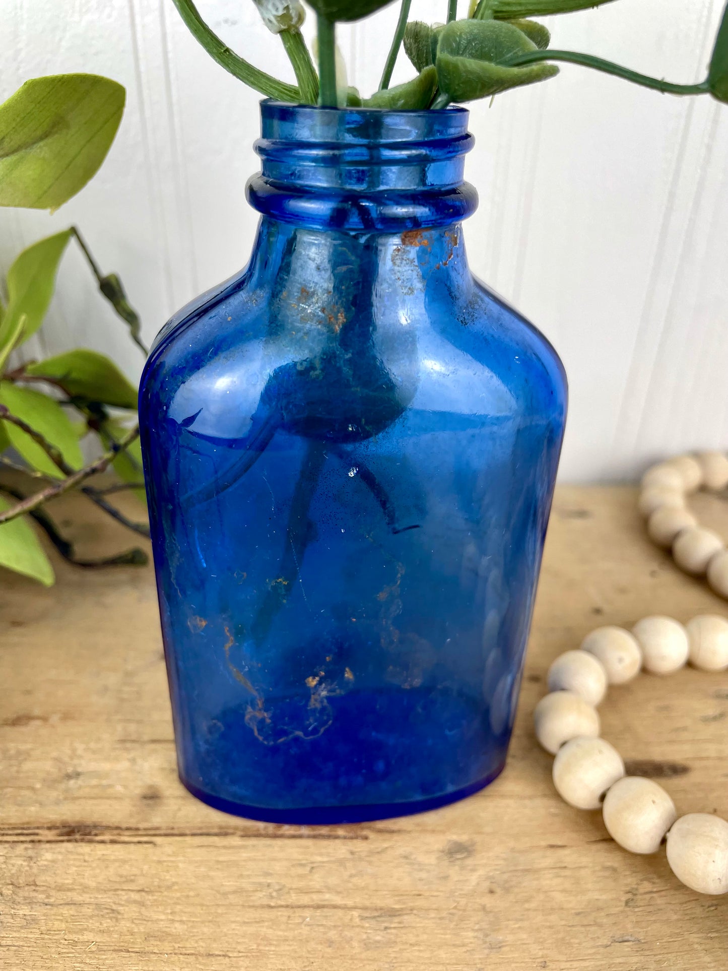 Vintage Cobalt Blue Glass Medicine Bottle with Greenery