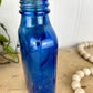 Vintage Cobalt Blue Glass Medicine Bottle with Greenery