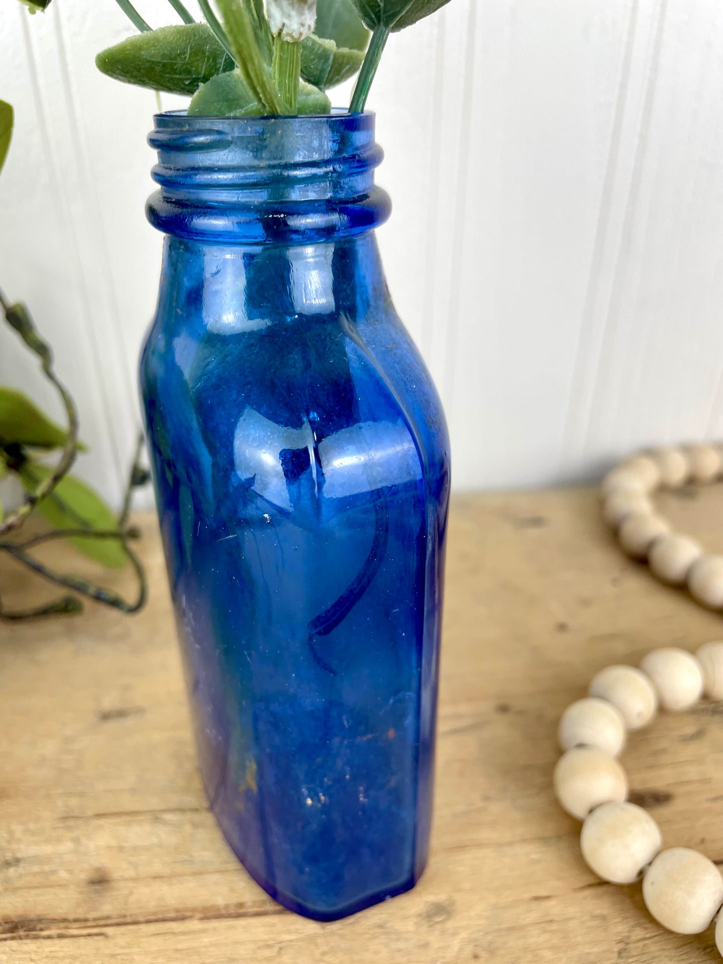 Vintage Cobalt Blue Glass Medicine Bottle with Greenery