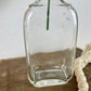 Vintage Clear Glass Bottle with Greenery