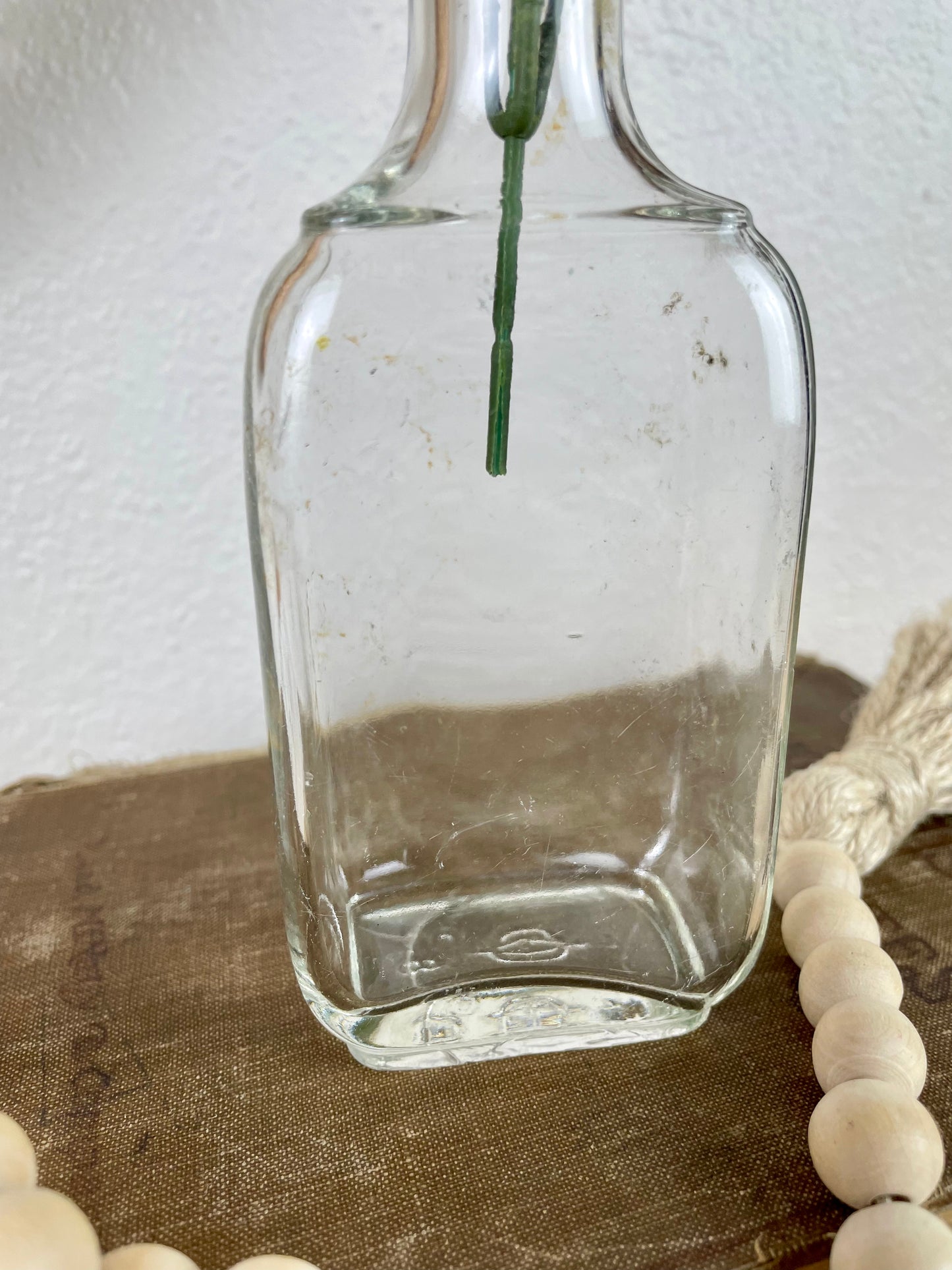 Vintage Clear Glass Bottle with Greenery